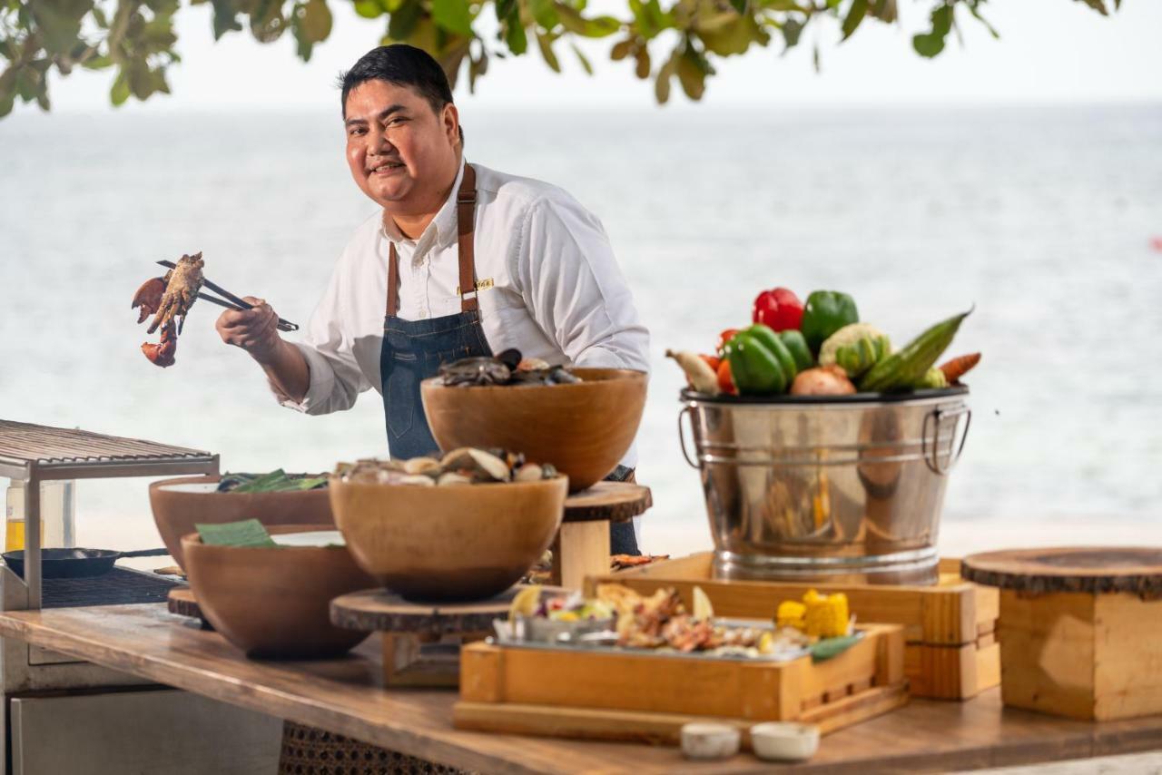 Oceanica Resort Panglao, Bohol Exterior photo Chef preparing food at the hotel