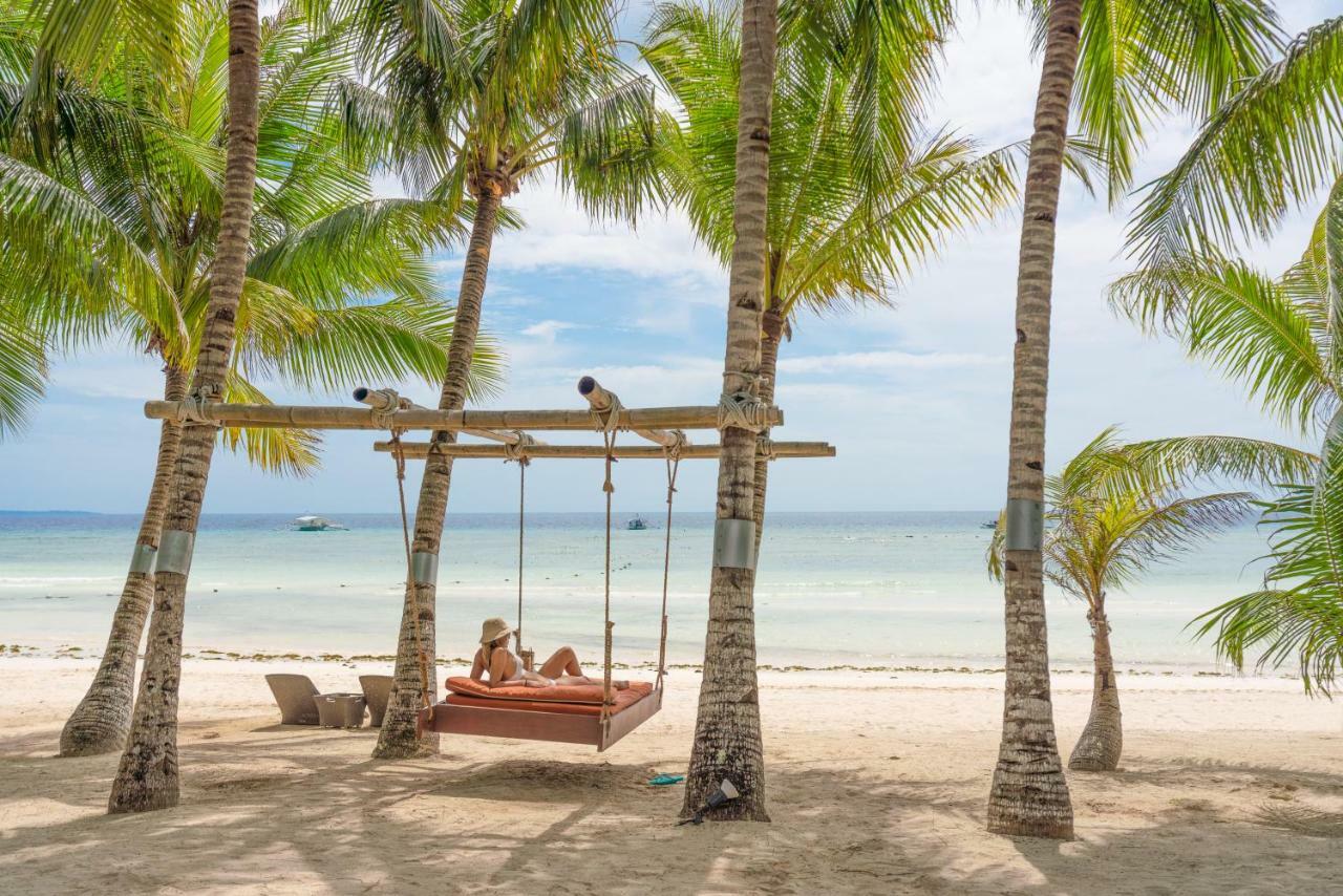 Oceanica Resort Panglao, Bohol Exterior photo A swing at the beach